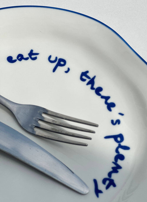 'eat up there's plenty more.' Plate