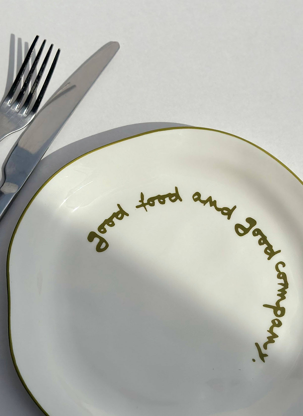 'good food and good company.' Plate